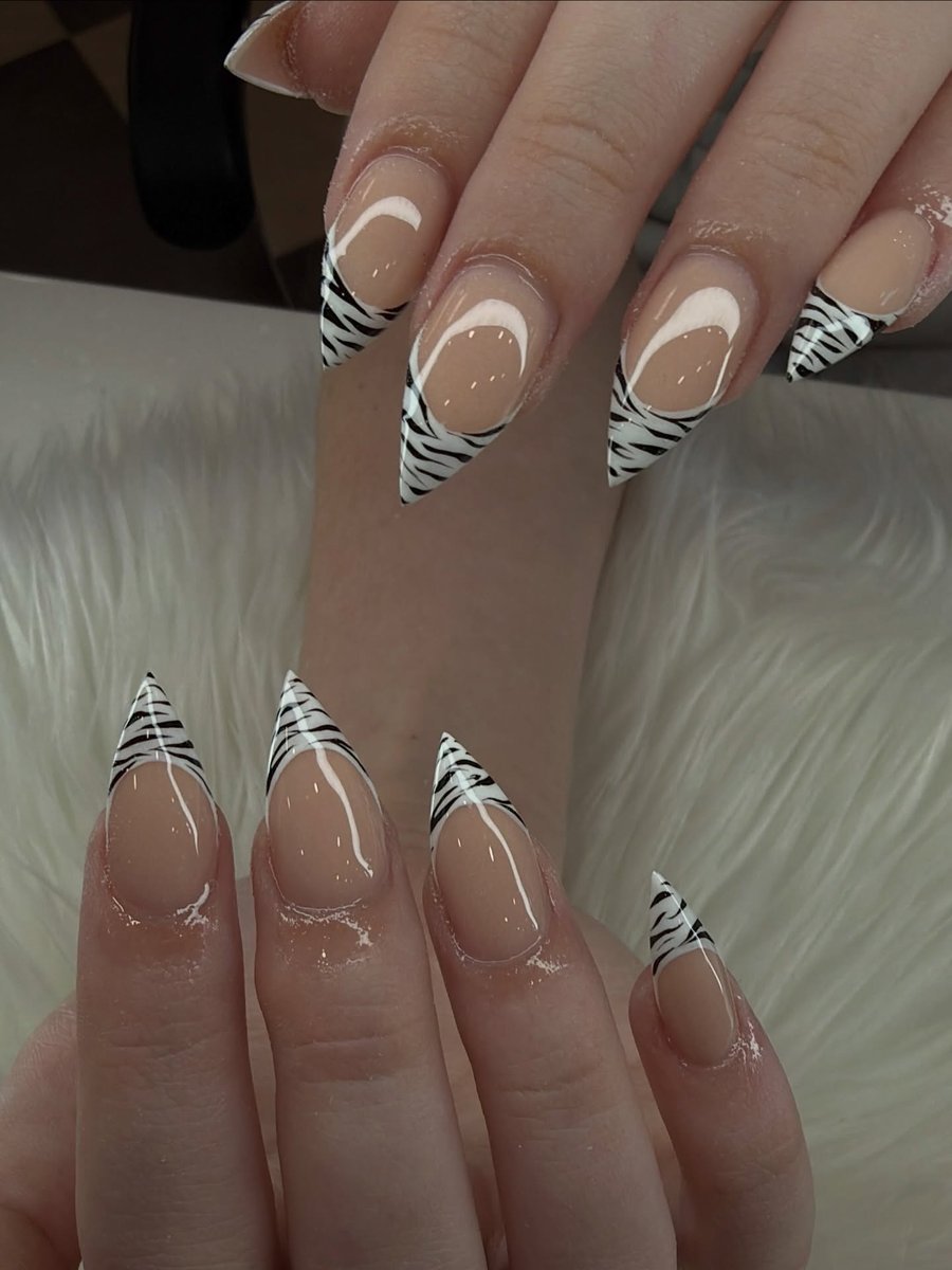 Zebra-print black and white stiletto nails