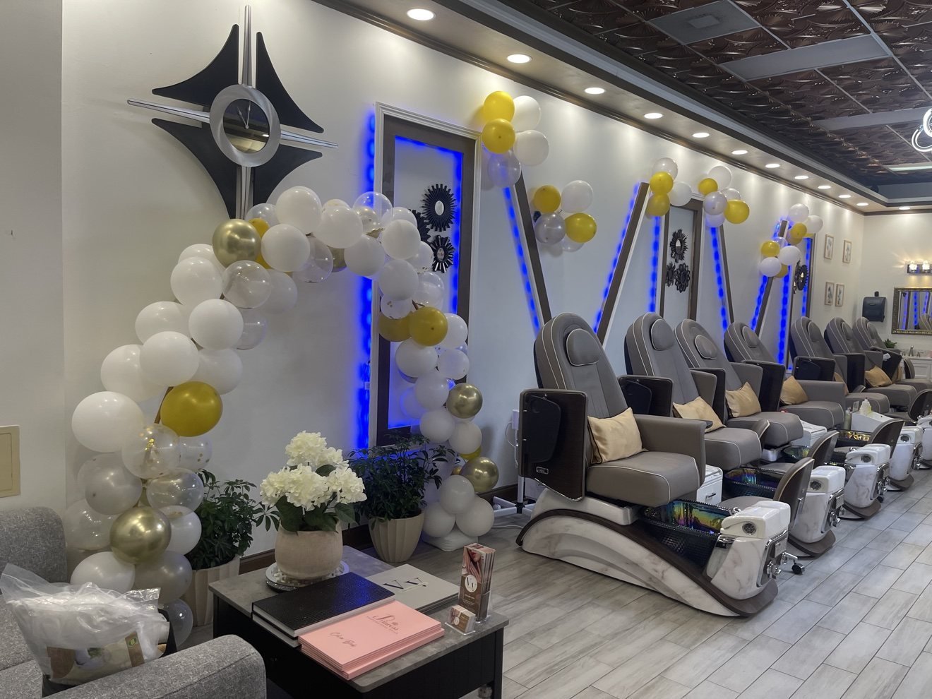 Spa pedicure lounge with massage chairs at Vivid Nails